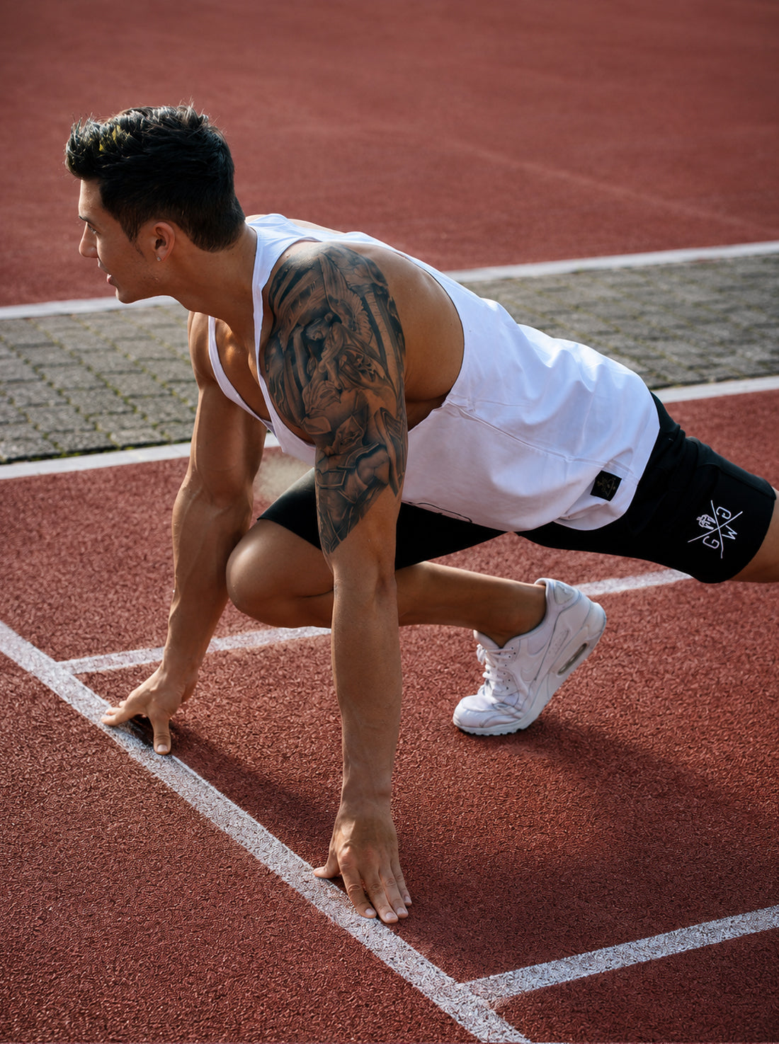 Athletic men's tank top in white – perfect for showcasing strength.