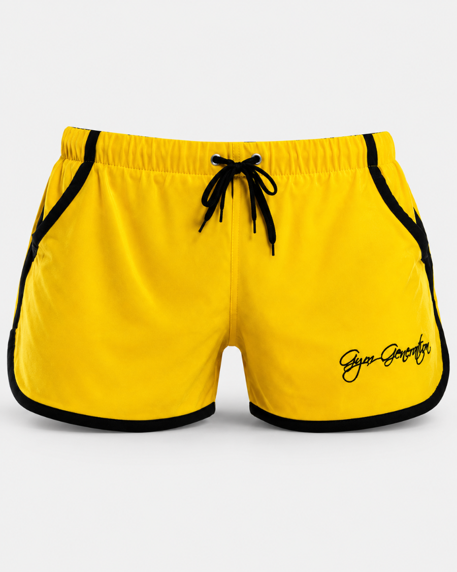 Gelbe Gym Generation Gym Shorts für Herren mit schwarzen Kontraststreifen, Kordelzug und Logo in Frontansicht.