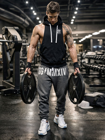 Athlet trägt Gym Generation Herren Jogginghose in Dunkelgrau beim Krafttraining im Fitnessstudio, sportliche Trainingshose im aktiven Einsatz mit Gewichten