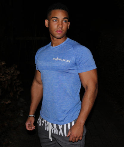 Men's seamless t-shirt in blue on a model, close-fitting with short raglan sleeves and white lettering, Gym Generation