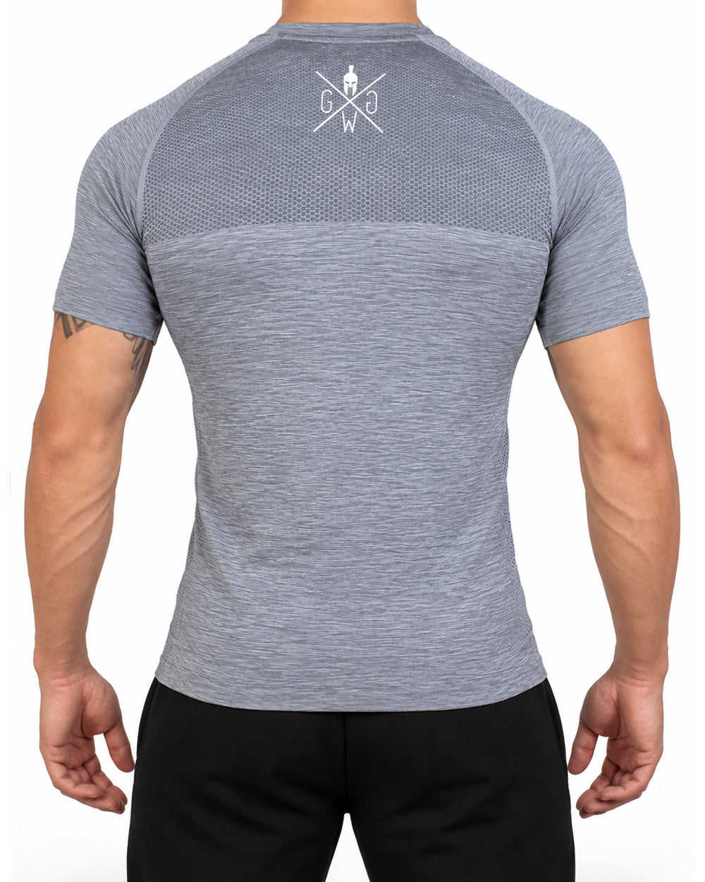 Back view of the gray men's seamless t-shirt with honeycomb knit on the upper back and white logo on the neck, Gym Generation