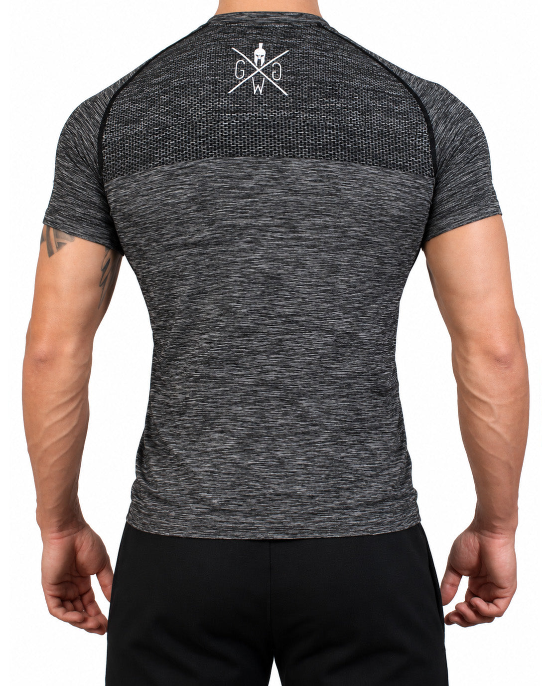 Retro della t-shirt seamless nera da uomo con nido d'ape sulla parte alta della schiena e logo bianco sulla nuca, Gym Generation