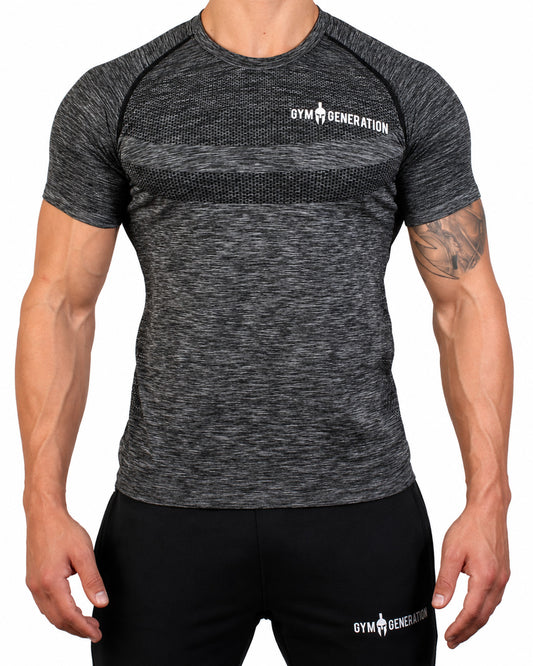 T-shirt seamless homme noir chiné de face, avec tricot nid d'abeille sur la poitrine, coutures raglan contrastées et lettrage Gym Generation blanc