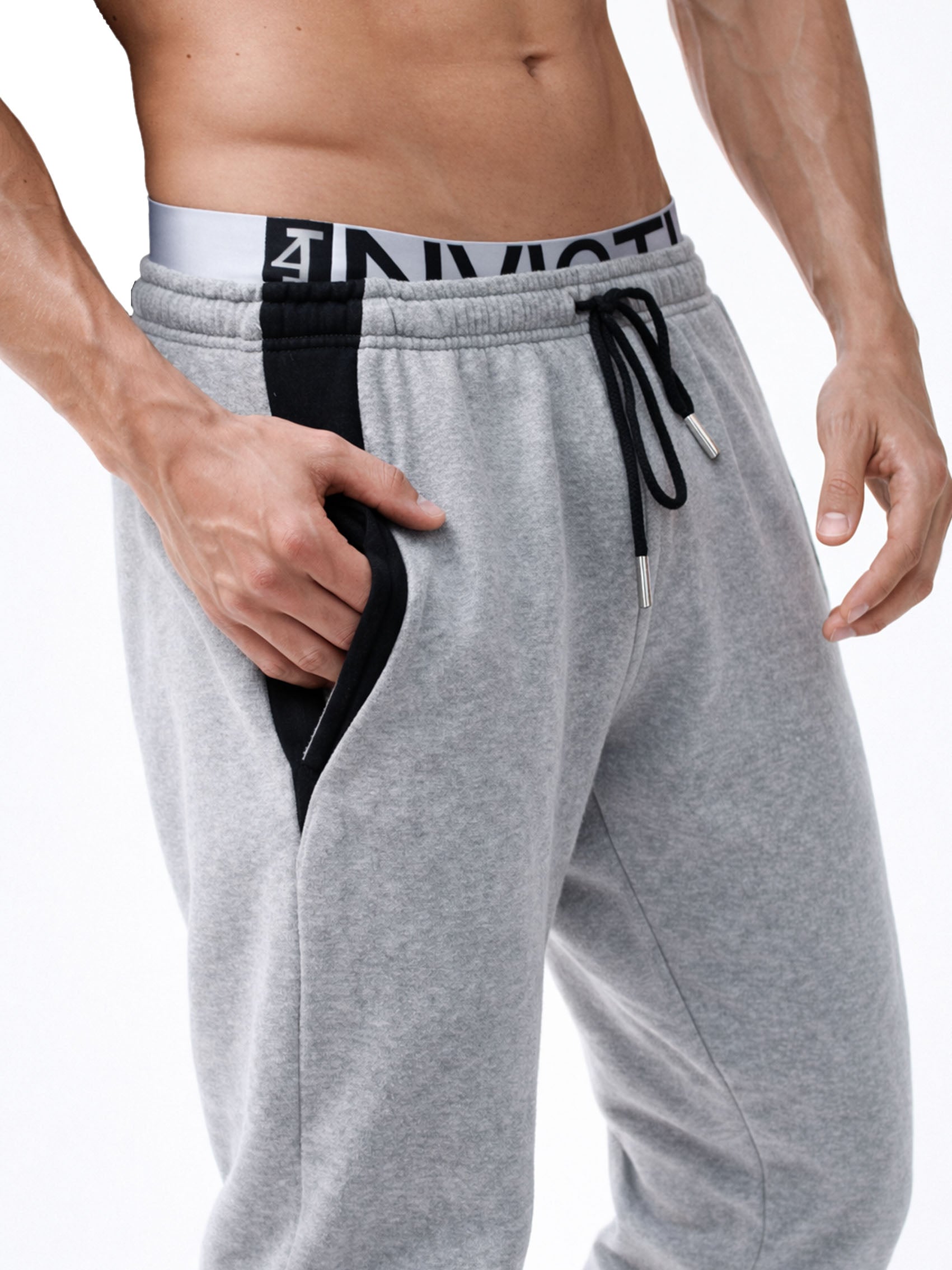 Graue Herren Jogginghose von Gym Generation mit elastischem Bund, Kordelzug und seitlicher Tasche – hochwertiges Fitness- und Streetwear-Detail