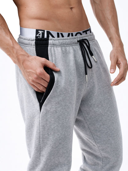 Graue Herren Jogginghose von Gym Generation mit elastischem Bund, Kordelzug und seitlicher Tasche – hochwertiges Fitness- und Streetwear-Detail