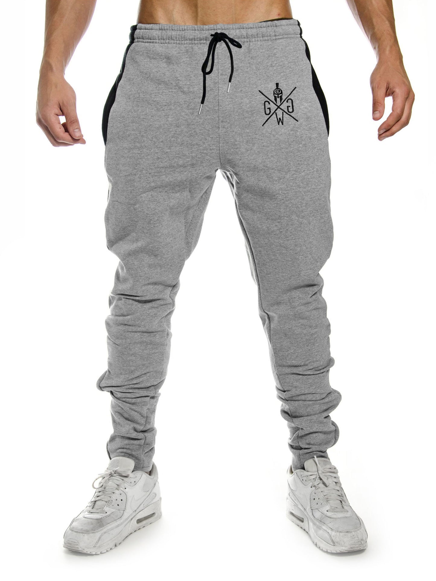 Graue Jogginghose für Herren – modernes Design mit weichem Fleece-Futter, elastischem Bund und Reissverschlüssen, perfekt für Sport und Alltag.